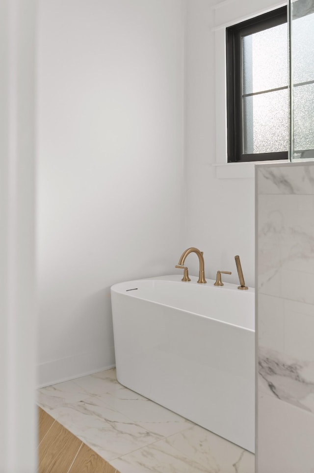 bathroom with a tub