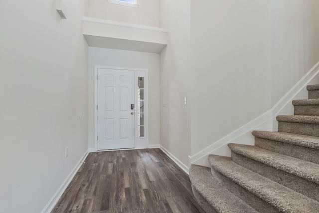 foyer entrance featuring dark hardwood / wood-style flooring