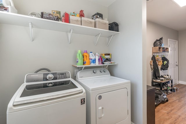 washroom featuring independent washer and dryer and hardwood / wood-style floors