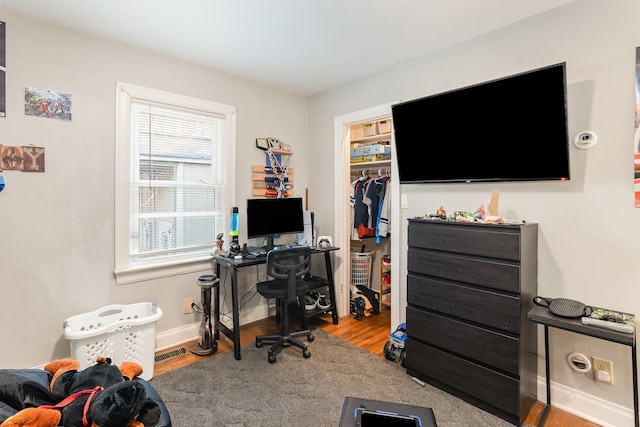 office area with light hardwood / wood-style floors