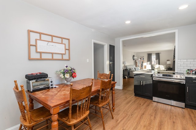 dining area with light hardwood / wood-style floors