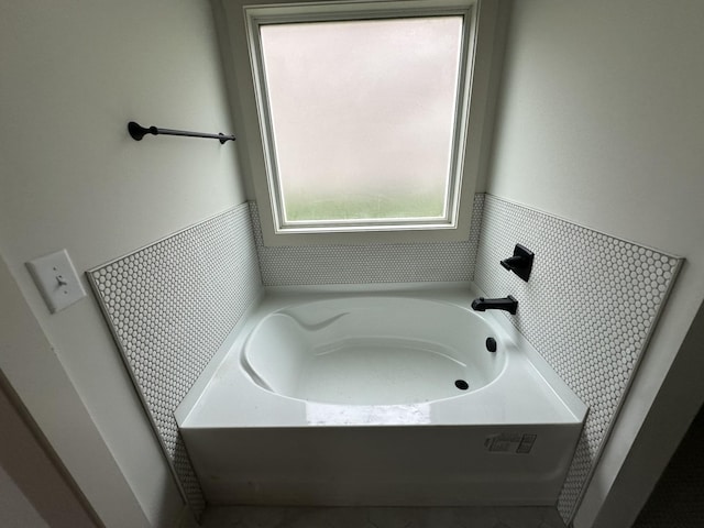 bathroom with a washtub