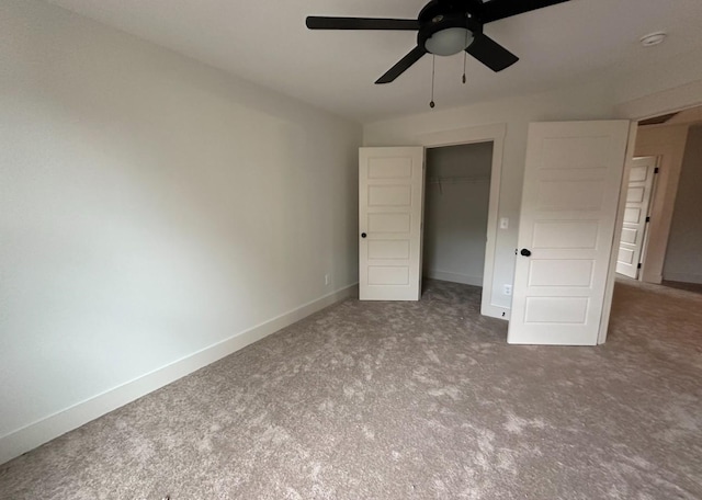 unfurnished bedroom featuring ceiling fan, a closet, and carpet floors