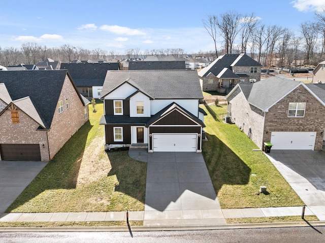 front facade with a garage and a front lawn