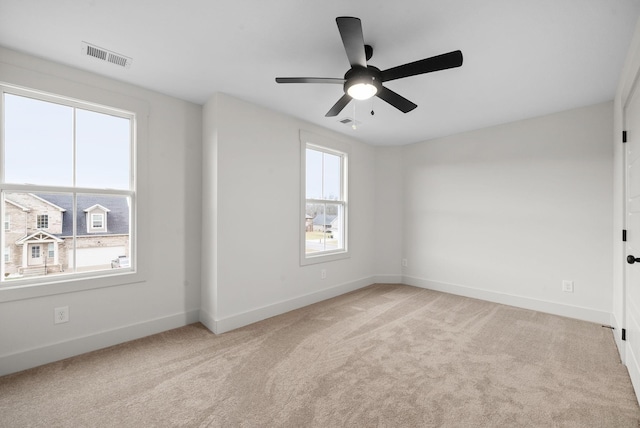 carpeted empty room with ceiling fan