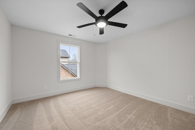 carpeted empty room with ceiling fan