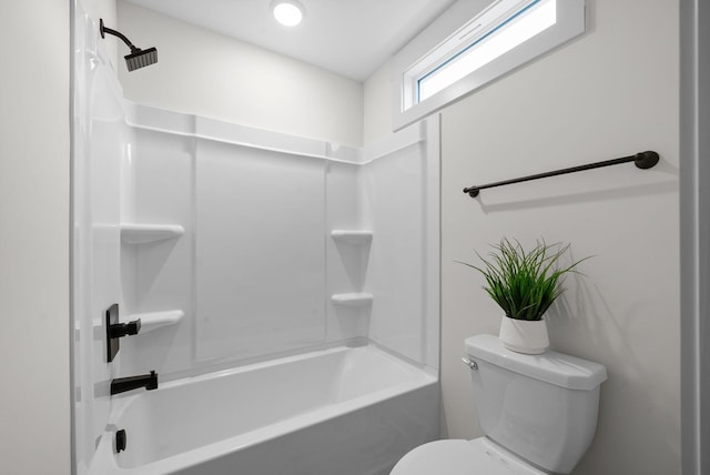 bathroom with washtub / shower combination and toilet