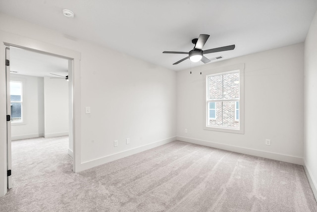 unfurnished room with light carpet and ceiling fan