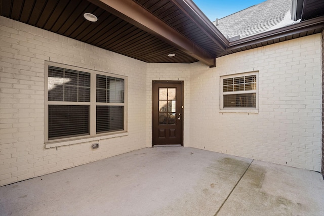 doorway to property with a patio area