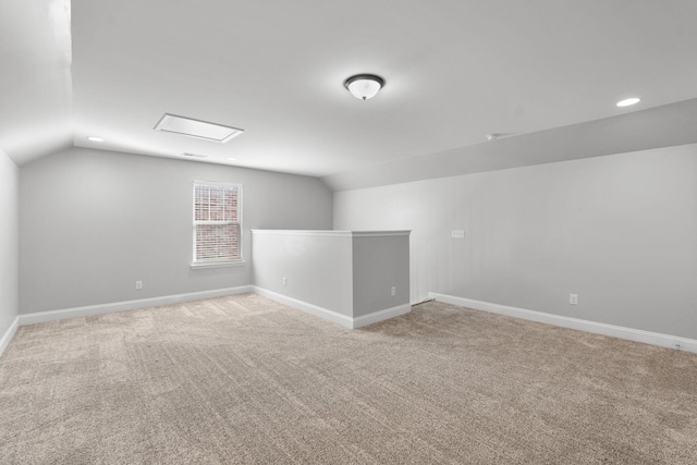 bonus room with carpet and lofted ceiling