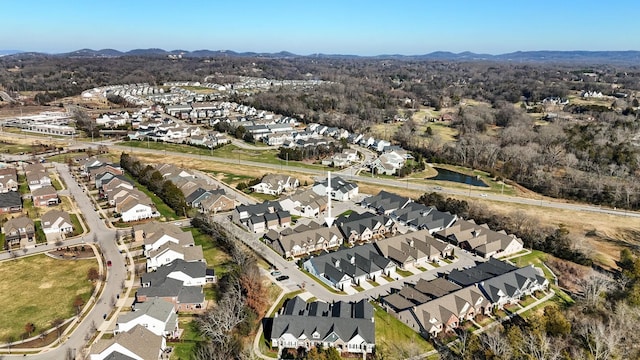 birds eye view of property featuring a mountain view