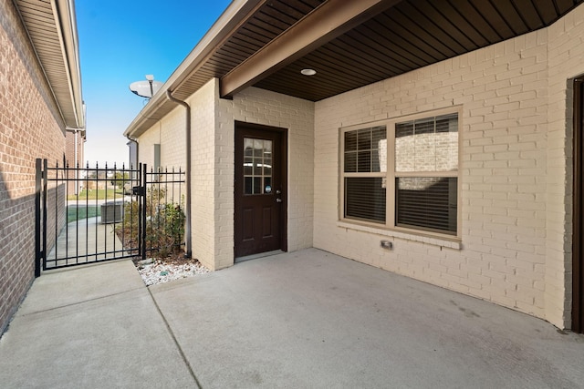 entrance to property with a patio