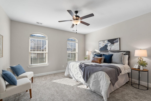 bedroom with ceiling fan and light colored carpet