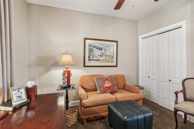 carpeted living room featuring ceiling fan