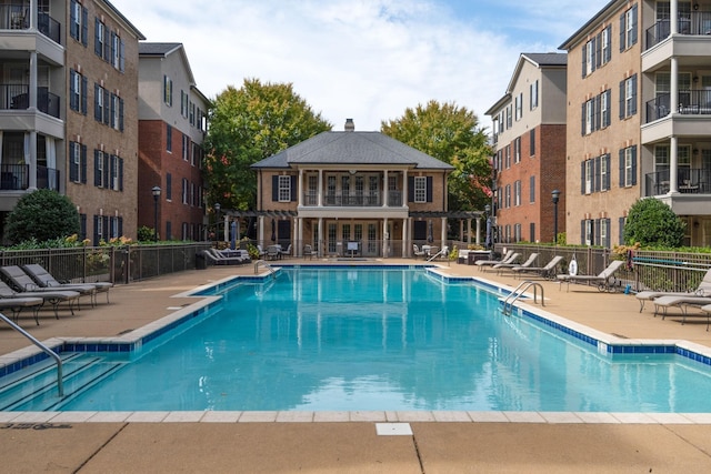 view of swimming pool with a patio area