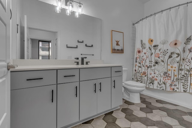 full bathroom featuring toilet, vanity, and shower / bath combo