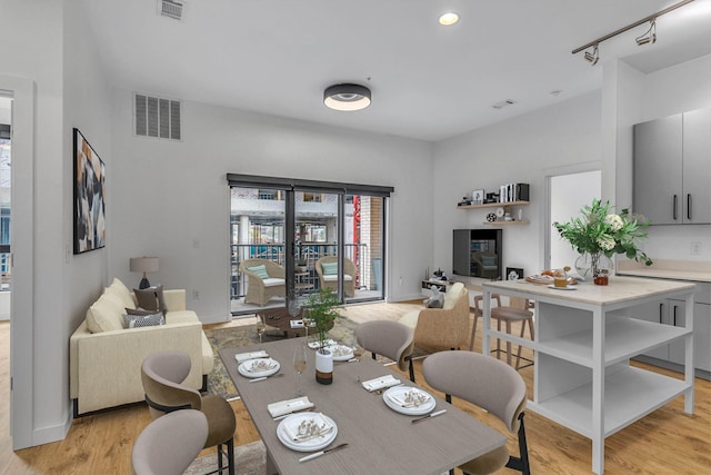 dining room with light wood-type flooring