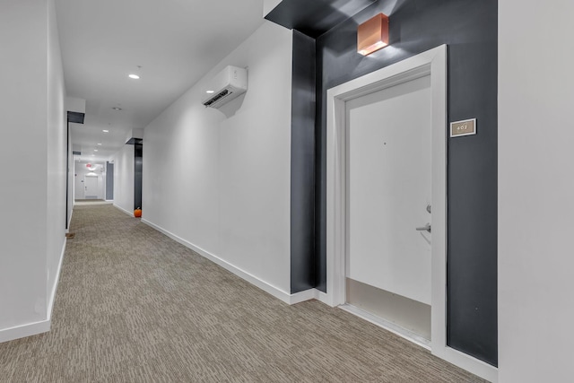 hall featuring light carpet and a wall unit AC