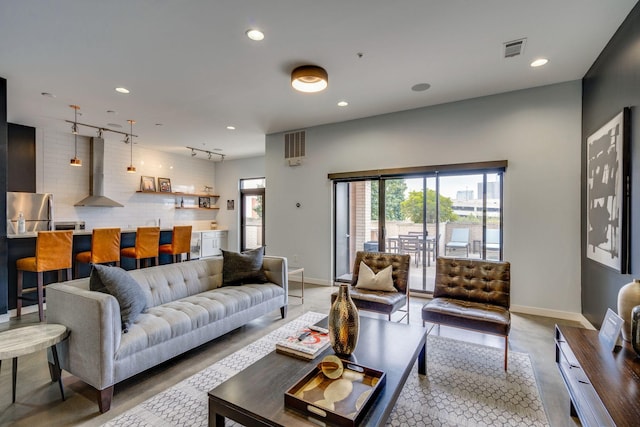 living room featuring rail lighting