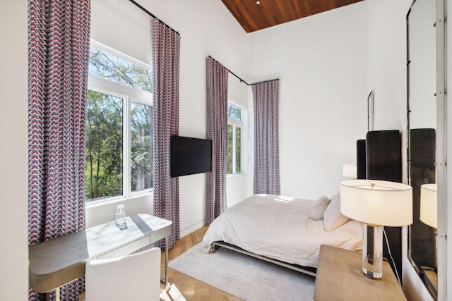 bedroom with wooden ceiling and hardwood / wood-style floors