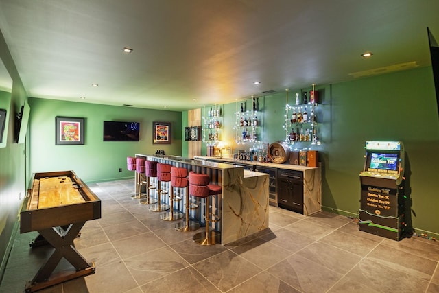 bar featuring light tile patterned flooring