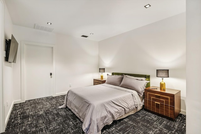 bedroom featuring dark colored carpet