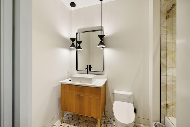 bathroom featuring vanity and toilet