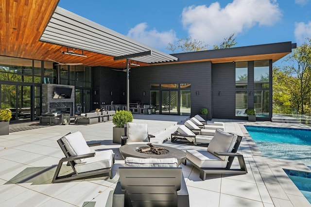 view of patio / terrace with an outdoor fireplace and an outdoor fire pit