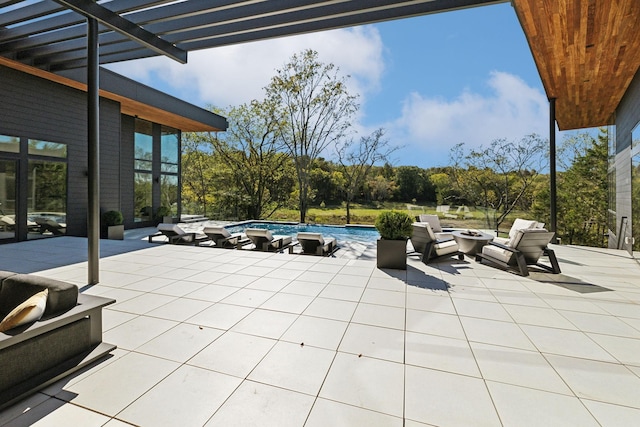 view of patio / terrace featuring an outdoor fire pit and a pergola