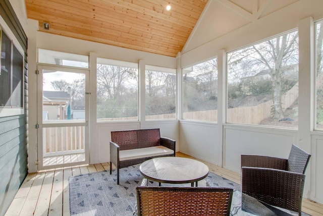 sunroom / solarium with lofted ceiling and wooden ceiling