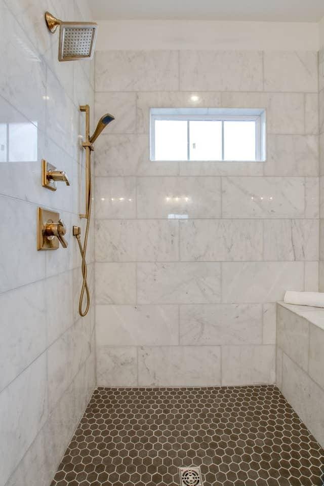 bathroom with a tile shower