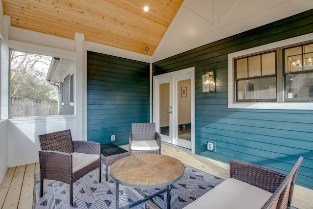 exterior space with french doors, vaulted ceiling, and wood ceiling