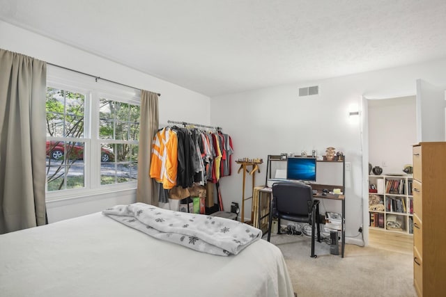 bedroom with light carpet