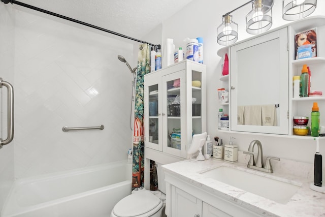 full bathroom with toilet, a textured ceiling, shower / bath combo with shower curtain, and vanity