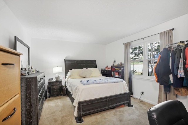 bedroom with light carpet