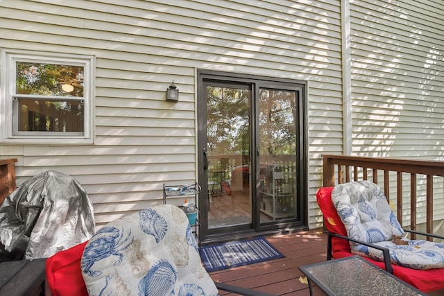 property entrance with a wooden deck