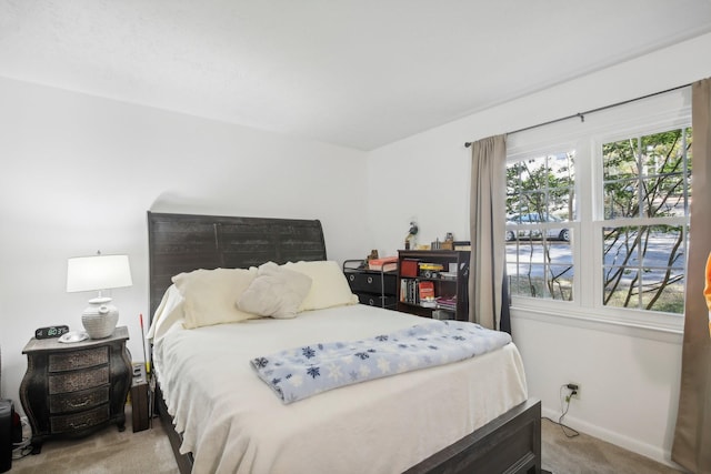 bedroom with light colored carpet