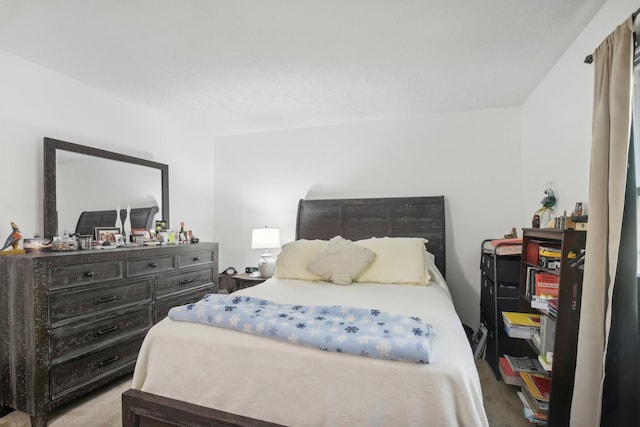 bedroom with light colored carpet