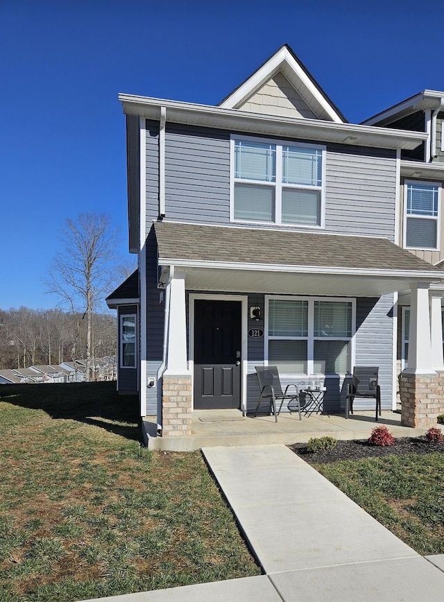 view of front of home featuring a porch and a front yard