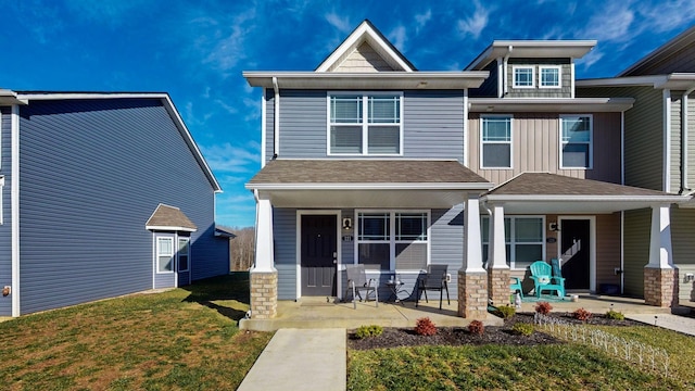 view of front of home with a front lawn and a porch