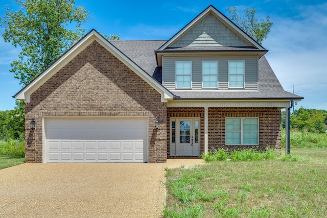 view of front facade featuring a front yard and a garage