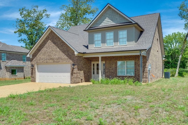 view of front of house featuring a garage, central AC, and a front yard