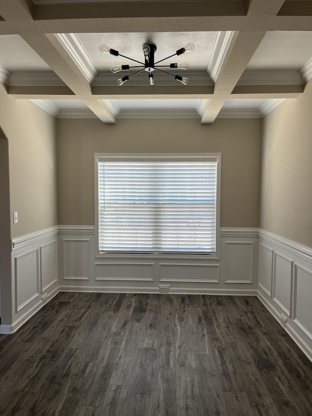 spare room featuring ornamental molding, coffered ceiling, plenty of natural light, and beamed ceiling