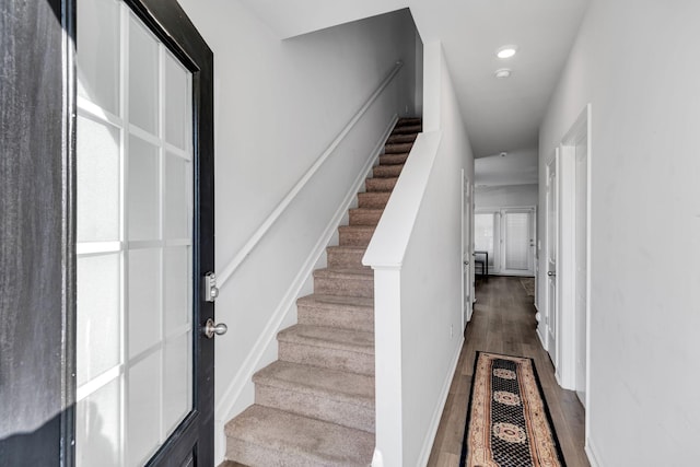 stairway featuring hardwood / wood-style floors