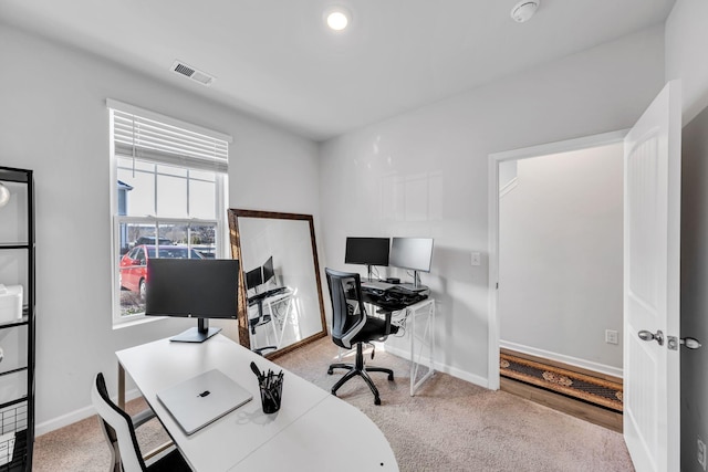 office space with light colored carpet