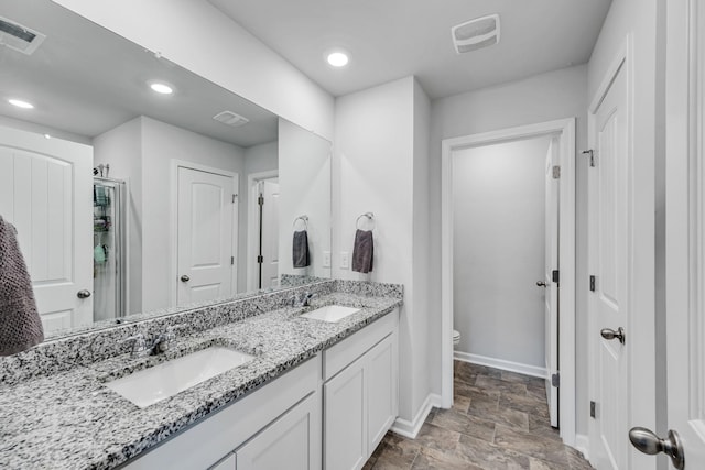 bathroom with toilet and vanity