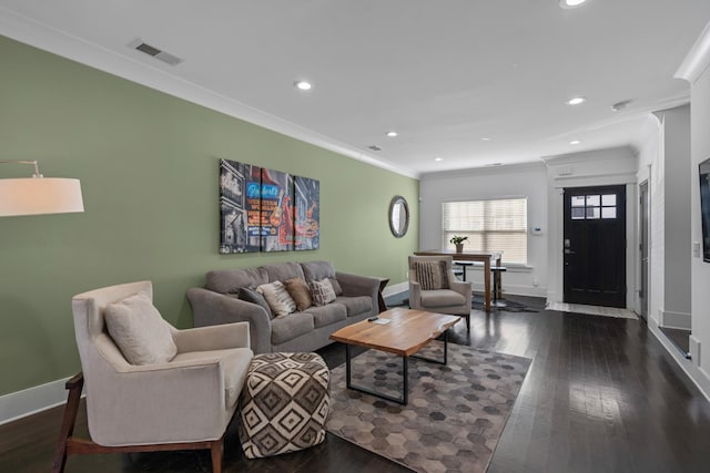 living room with ornamental molding and dark hardwood / wood-style floors