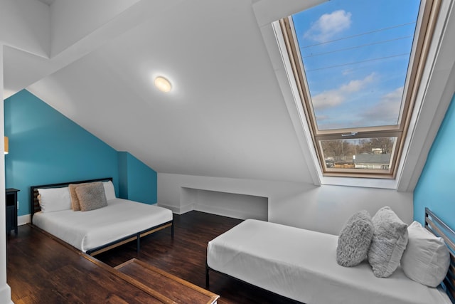 bedroom featuring multiple windows and dark hardwood / wood-style floors