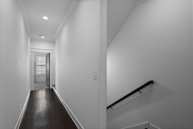 hall with crown molding and dark hardwood / wood-style flooring