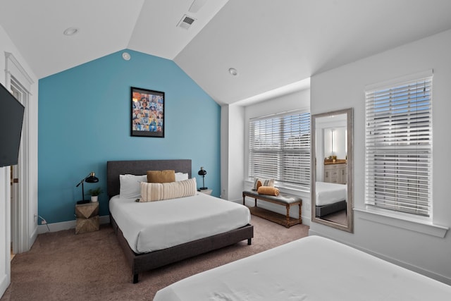 bedroom with lofted ceiling and carpet